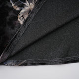 A black velvet midi dress with a butterfly print pattern named Blanche on a plain background