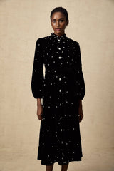 A black velvet midi dress with embellishments named Lola featuring a sleek design and elegant appearance