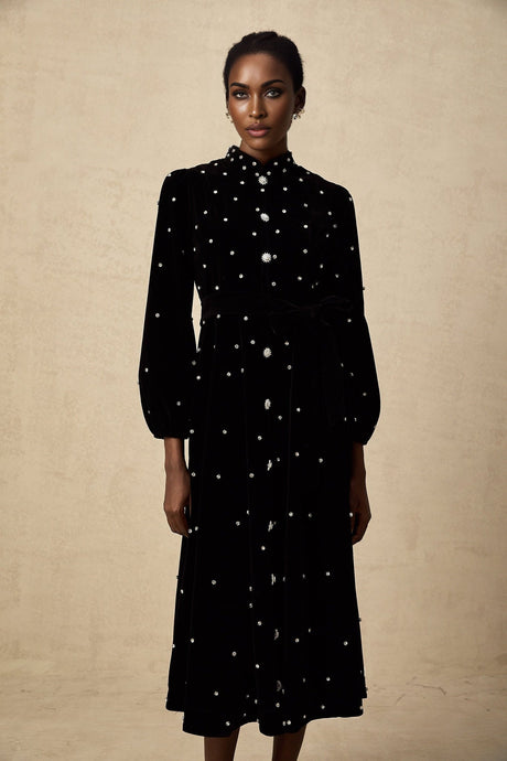 A black velvet midi dress with embellishments named Lola featuring a sleek design and elegant appearance