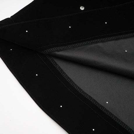 A black velvet midi dress with embellishments named Lola featuring a sleek silhouette and elegant design