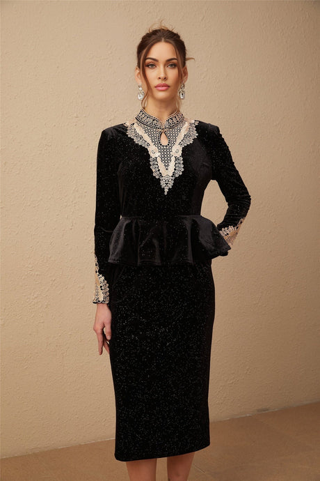 A black velvet midi dress with embellishments named Roxane featuring a sleek design and elegant details