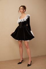 A black velvet mini dress with lace trim details named Fabiana