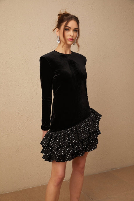 A black velvet mini dress with polka dot print featuring panelled design and ruffled details named Lucrezia