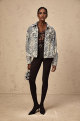 A blue denim jacket with sequined flower embroidery featuring a design called Mailys