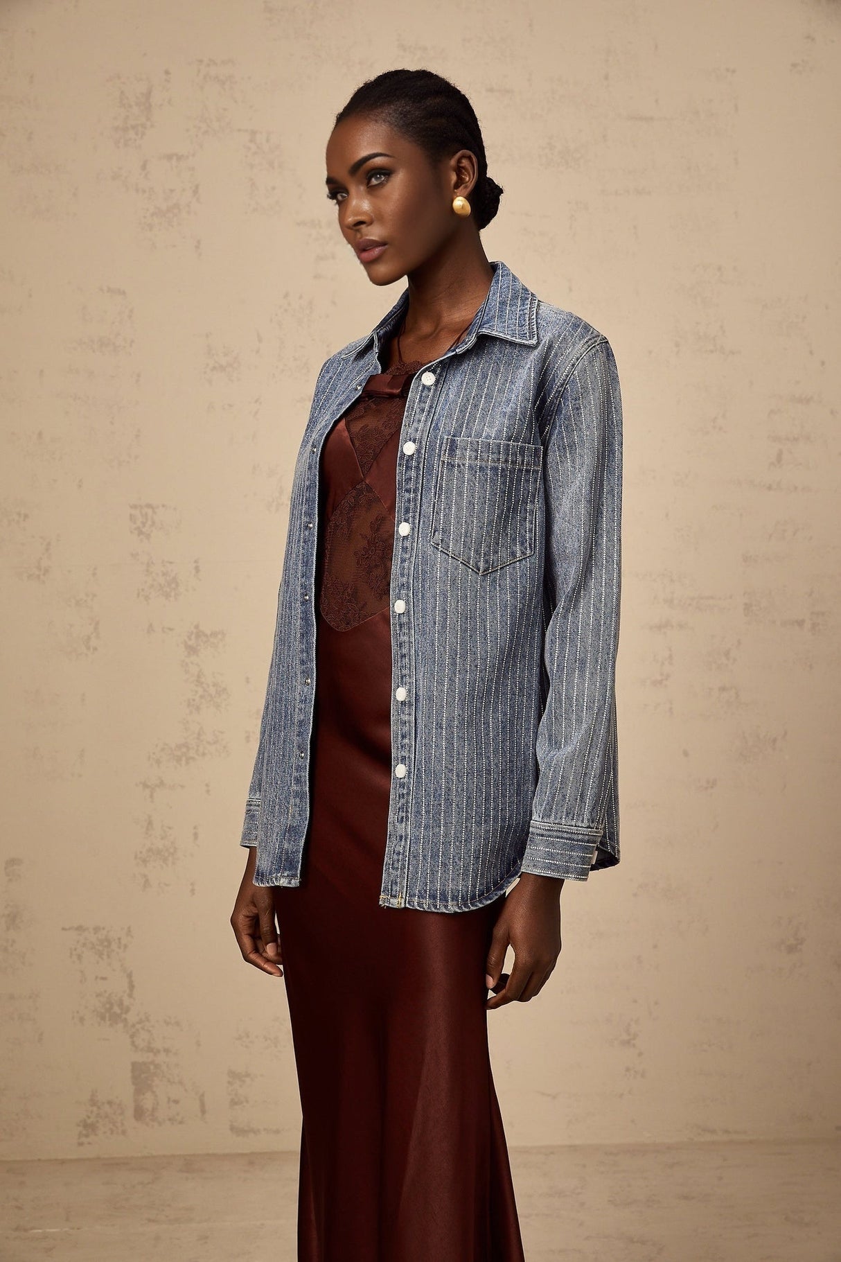 A blue denim shirt with vertical stripes and embellishments named Josephine