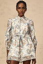 A blue floral print jumpsuit with ruffles and lace trim details named Eugenie
