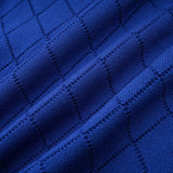 A blue knitted matching set featuring a top and skirt The top has button details and the outfit is designed by Maelys