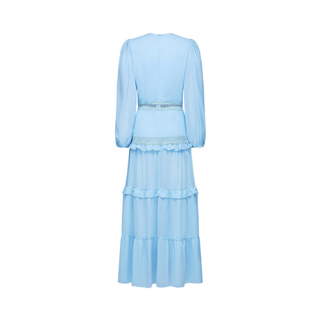 A blue maxi dress named Juno featuring cut out details and ruffles