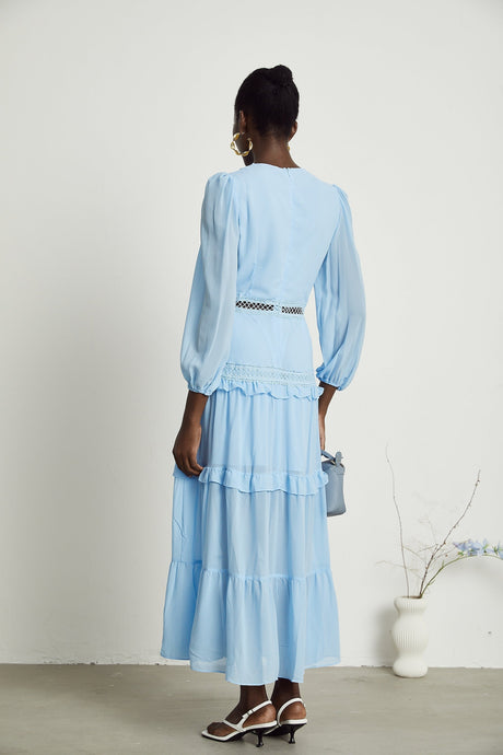 A blue maxi dress named Juno featuring cutouts and ruffles