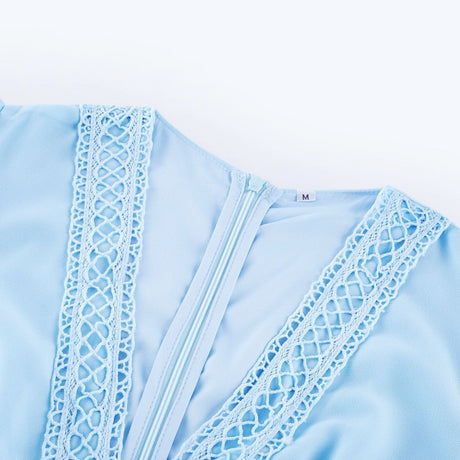 A blue maxi dress with cutouts and ruffles called Juno