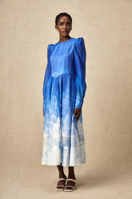 A blue midi dress with a gradient color effect and pleated design named Adonia