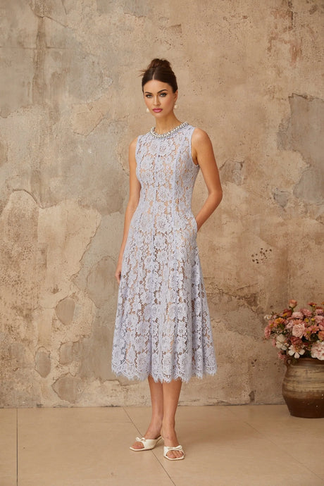 A blue midi dress with floral lace pattern and embellishments featuring a fitted silhouette and delicate details