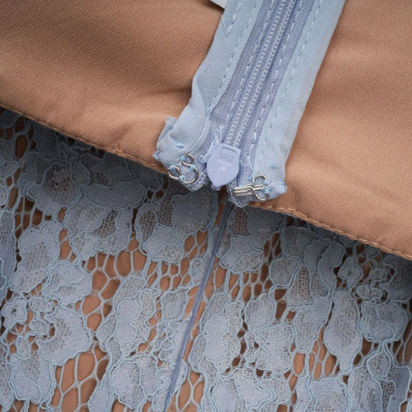 A blue midi dress with floral lace pattern featuring a boned bodice and an Audrey style silhouette