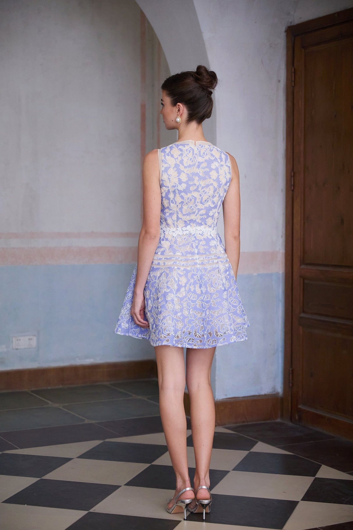 A blue mini dress with crochet lace detailing and puff sleeves named Brigitte