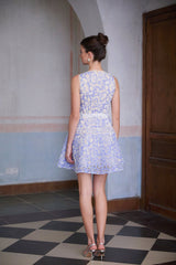 A blue mini dress with crochet lace detailing and puff sleeves named Brigitte