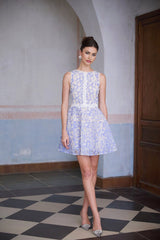 A blue mini dress with crochet lace detailing and puff sleeves named Brigitte
