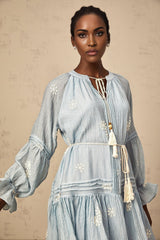 A blue mini dress with delicate flower embroidery details featuring a feminine and elegant design