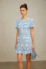 A blue mini dress with floral applique and ruffled lace details featuring a feminine and delicate design