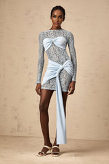 A blue mini dress with floral lace panels and a fitted silhouette from Anouk
