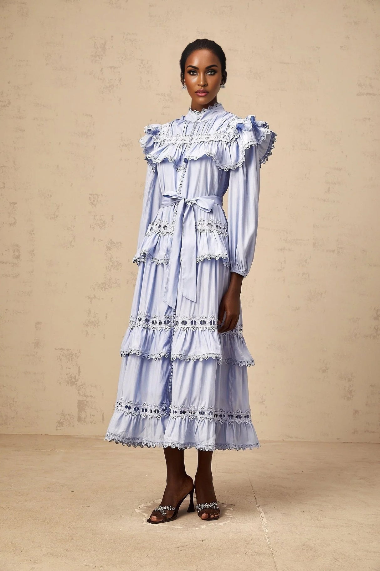 A blue tiered midi dress with lace trim details named Veronique