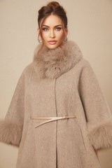 A brown wool cape coat with fur trim and a belt cinching the waist