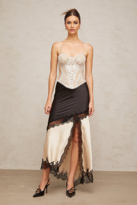 A bustier top with a floral lace design featuring panelling named Karine