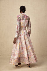 A cherry pink matching set featuring a patterned shirt and skirt with a floral or fruit print design