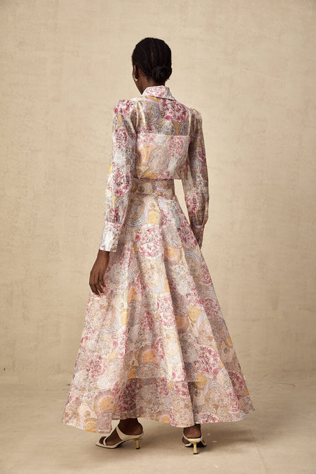 A cherry pink matching set featuring a patterned shirt and skirt with a floral or fruit print design