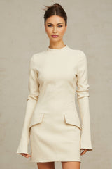 A creamwhite fitted mini dress by Chloé on a plain background