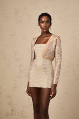 A cropped jacket with stud embellishments named Ubalda shown on a white background