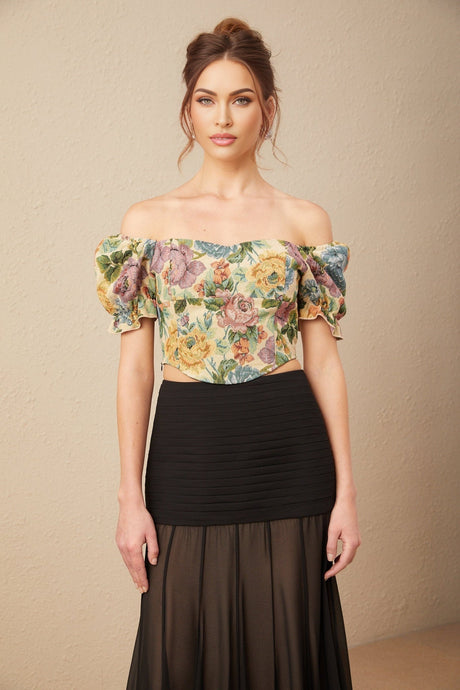 A cropped top featuring a floral print pattern on jacquard fabric with the name Constance