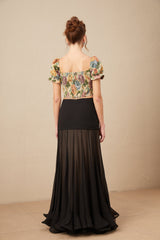 A cropped top with a floral print pattern in jacquard fabric named Constance featuring a colorful design on a textured background