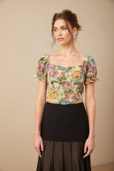 A cropped top with a floral print pattern on jacquard fabric featuring a design named Constance