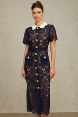A dark blue midi dress with a floral crochet lace pattern covering the entire garment