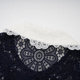 A dark blue midi dress with floral crochet lace pattern and delicate details