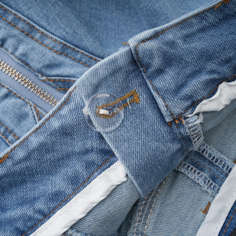 A denim skirt with a ruffled hem called Capucine Denimrock featuring a volant or frilled bottom edge