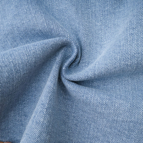 A denim skirt with a ruffled hem named Capucine featuring a volant style edge