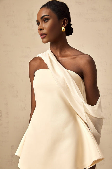 A feminine flared mini dress with ribbon design details featuring the Danaé style