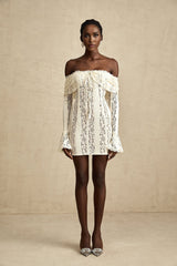 A feminine floral lace mini dress in neutral tones with flared cuffs named Emeline