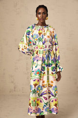 A feminine midi dress with a vibrant paisley print pattern on light poplin fabric featuring a flowing silhouette and delicate details