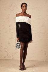 A fitted mini dress with color blocking and ruched detailing featuring a sleek silhouette in contrasting hues