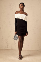 A fitted mini dress with ruched details featuring color blocking in the design named Angelique