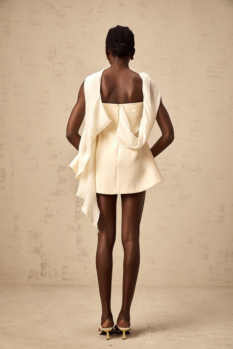 A flared mini dress with a ribbon design pattern named Danae shown on a model or mannequin