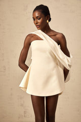 A flared mini dress with a ribbon design pattern named Danae