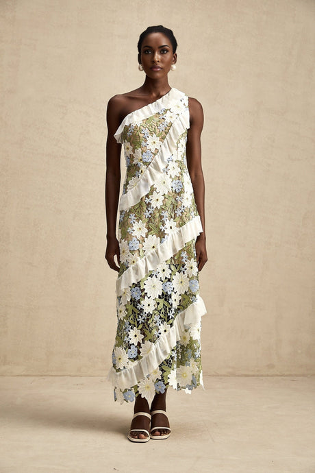 A floral embroidered midi dress named Clémence with a delicate pattern on a light colored fabric