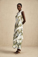 A floral embroidered midi dress with a Clémence design featuring delicate flower patterns on a light fabric