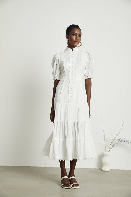 A floral lace midi dress with embroidered flowers in a feminine silhouette