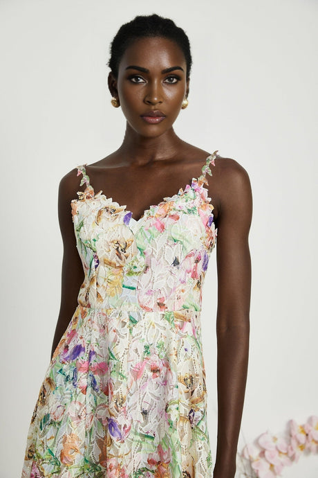 A floral lace midlength dress with embroidered flower details and delicate lacework throughout the garment