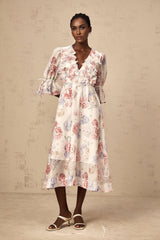 A floral midi dress with a 3d petal print featuring a vibrant pattern and a flattering silhouette