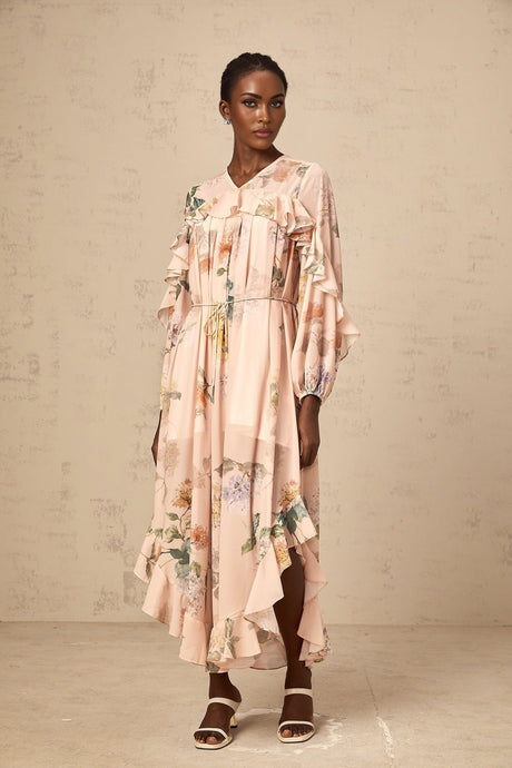 A floral patterned midi dress with ruffled trim named Patricia featuring a feminine silhouette and colorful print design